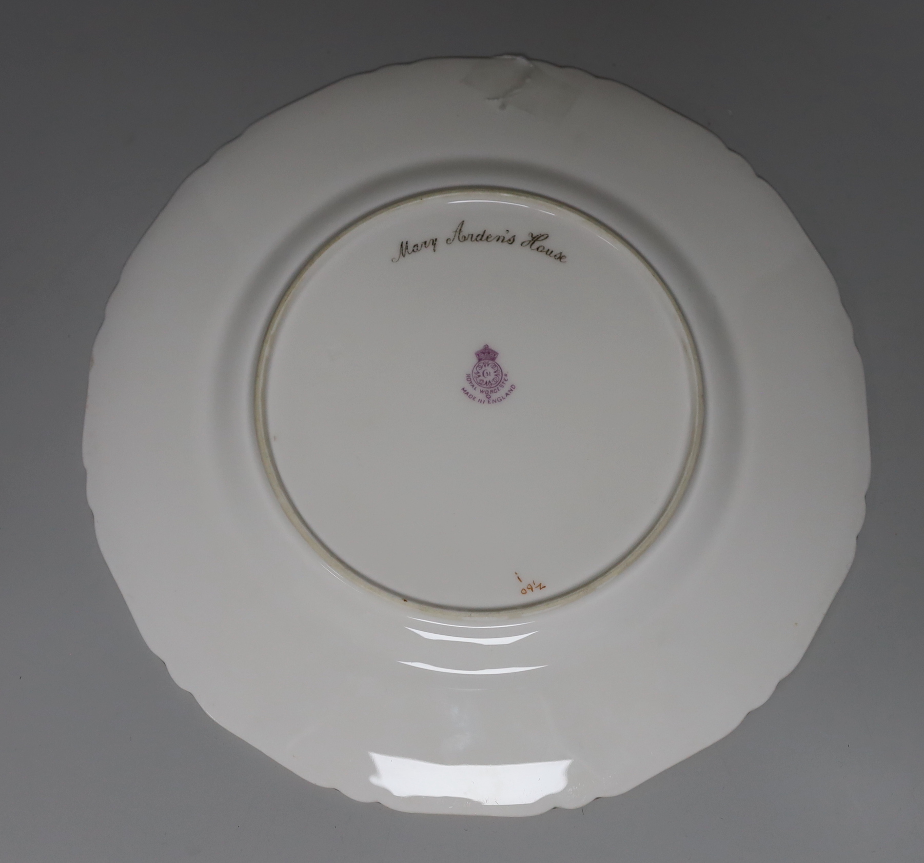 A Royal Worcester plate painted with Mary Arden's House by E. Barker, signed, date mark for 1929